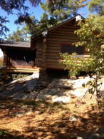 Log Cabin Exterior - Country homes for sale and luxury real estate including horse farms and property in the Caledon and King City areas near Toronto